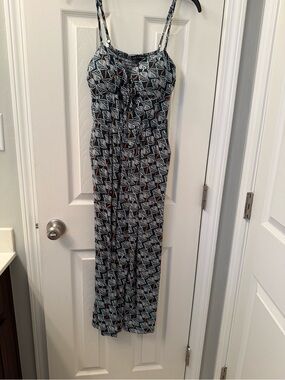 As U Wish Green and White Leaf-Print Smocked Jumpsuit with rust accents